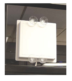 Patch antenna mounted to a window with suction cups